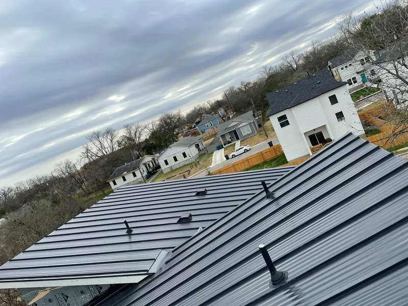 Standing seam metal roof panels with vents for Skylight Repair in Arlington